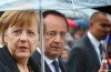 Angela Merkel et françois Hollande sont dans la Pluie