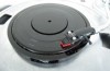 Vibrating ‘universal plate’ that connects turntable with digital media players